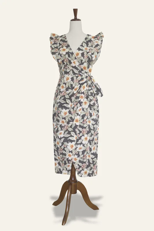 After Poof: the same dress on a warm ivory background, with a soft shadow under the stand.
